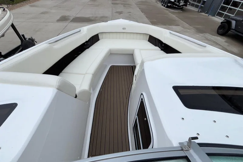  Yacht Photos Pics 2022 Cobalt R35 boat interior with white seating and wooden flooring.