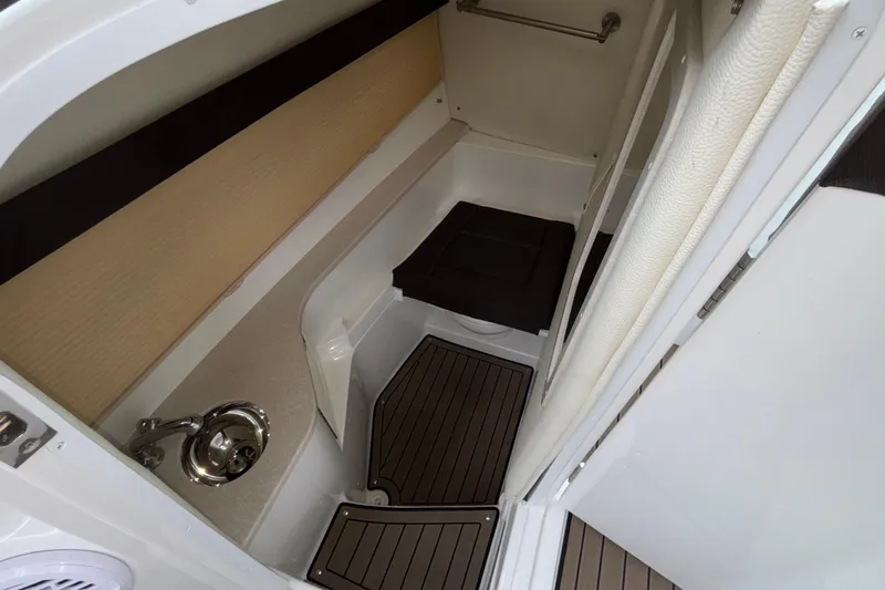  Yacht Photos Pics 2022 Cobalt R35 boat interior with compact bathroom and sink.