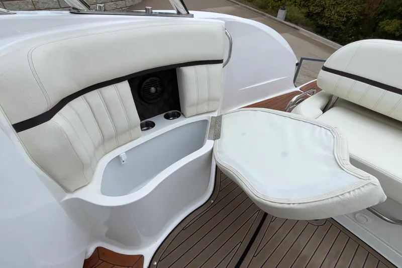  Yacht Photos Pics 2022 Cobalt R35 boat interior with white seating and foldable table.