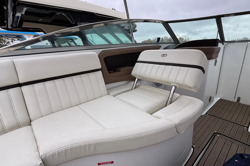  Yacht Photos Pics 2022 Cobalt R35 boat interior with white leather seating and sleek design.