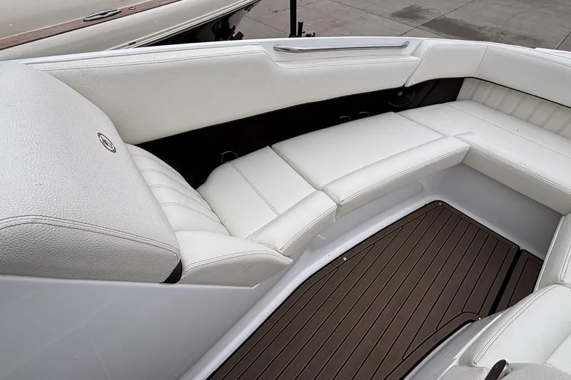  Yacht Photos Pics Luxurious white seating in 2022 Cobalt R35 boat, featuring elegant design and wood flooring.