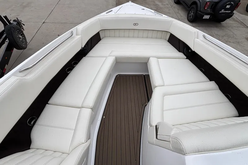 Yacht Photos Pics 2022 Cobalt R35 boat interior with white seating and brown flooring.