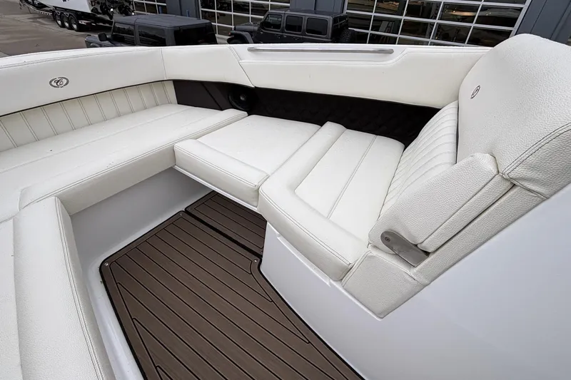  Yacht Photos Pics Luxurious seating on 2022 Cobalt R35 boat with white upholstery and wood-style flooring.