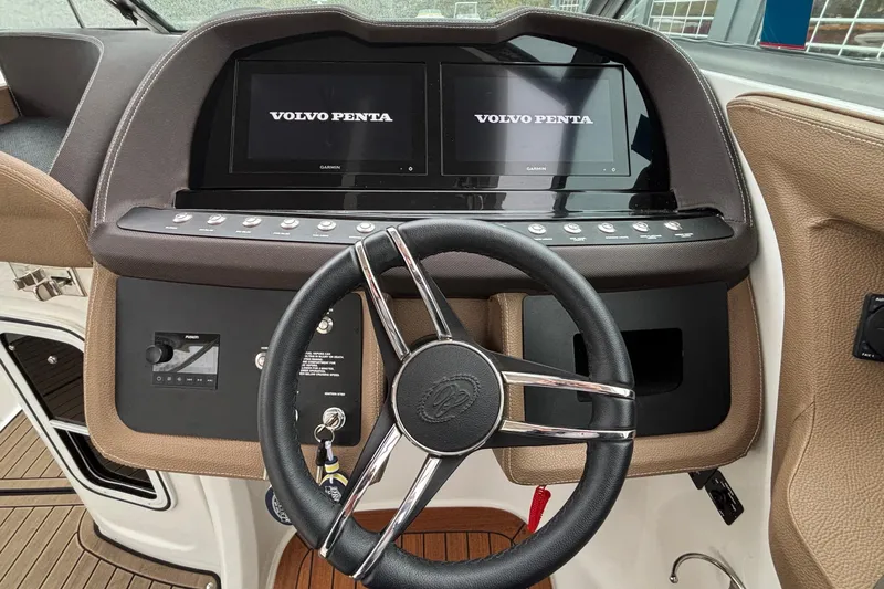  Yacht Photos Pics Steering wheel and dashboard of 2022 Cobalt R35 boat with Volvo Penta displays.