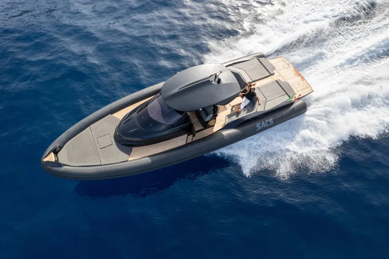  Yacht Photos Pics 2024 SACS Strider 15 luxury boat cruising on open water.