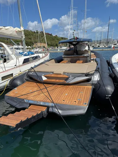  Yacht Photos Pics 2024 SACS Strider 15 luxury yacht docked in marina, featuring sleek design and spacious deck.