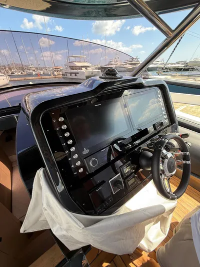  Yacht Photos Pics 2024 SACS Strider 15 dashboard with modern navigation system and steering wheel.