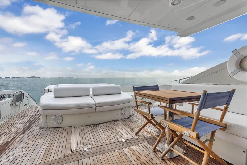  Yacht Photos Pics Luxury Azimut 68S yacht deck with seating and table, ocean view, 2006 model.