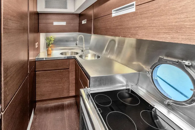  Yacht Photos Pics Modern kitchen in 2006 Azimut 68S yacht with sleek wood and stainless steel design.