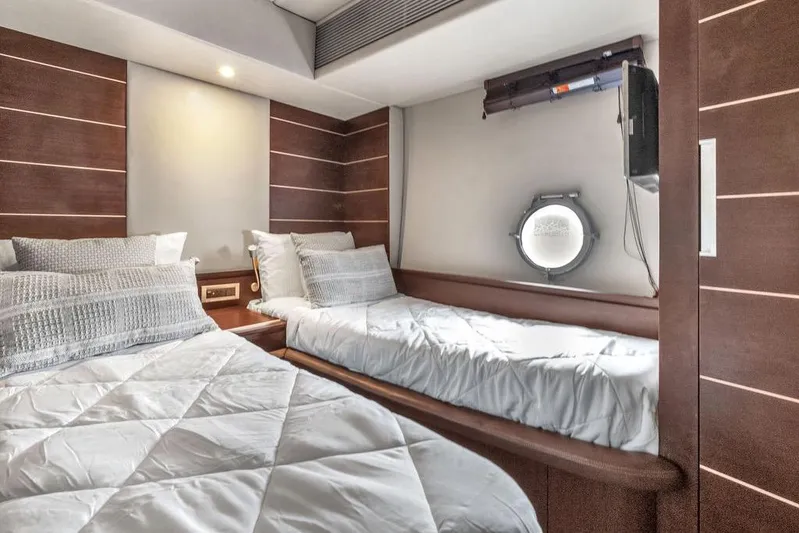  Yacht Photos Pics Luxurious cabin interior of 2006 Azimut 68S yacht with twin beds and porthole.