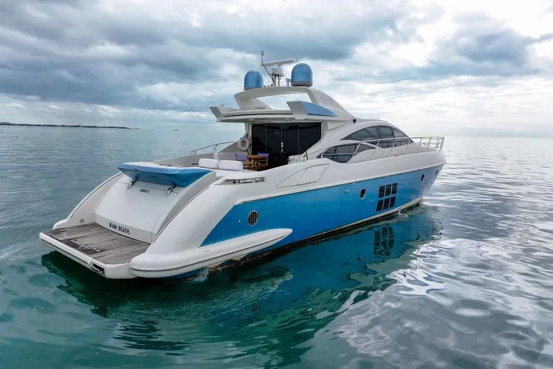  Yacht Photos Pics Luxury 2006 Azimut 68S yacht on calm ocean waters under cloudy sky.