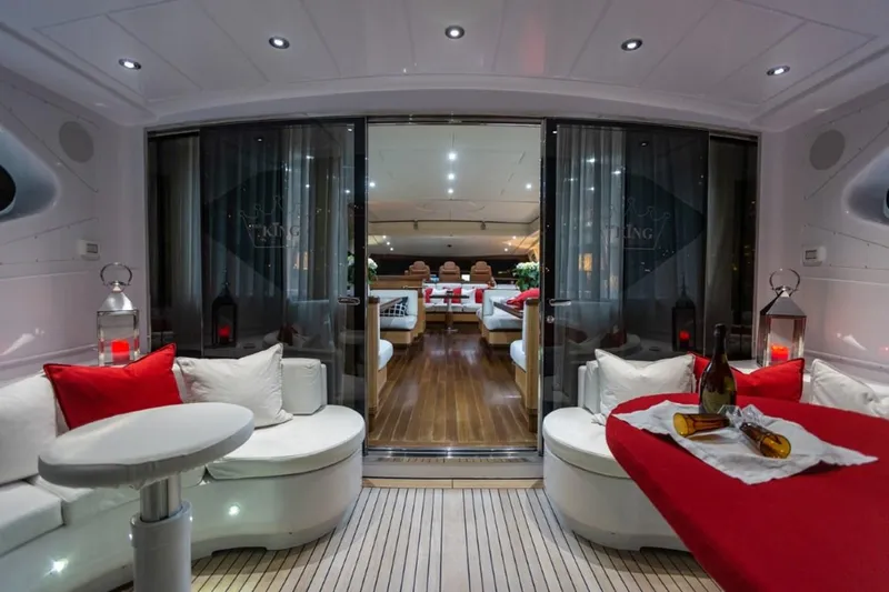  Yacht Photos Pics Luxurious 2004 Mangusta 108 yacht interior with elegant seating and ambient lighting.