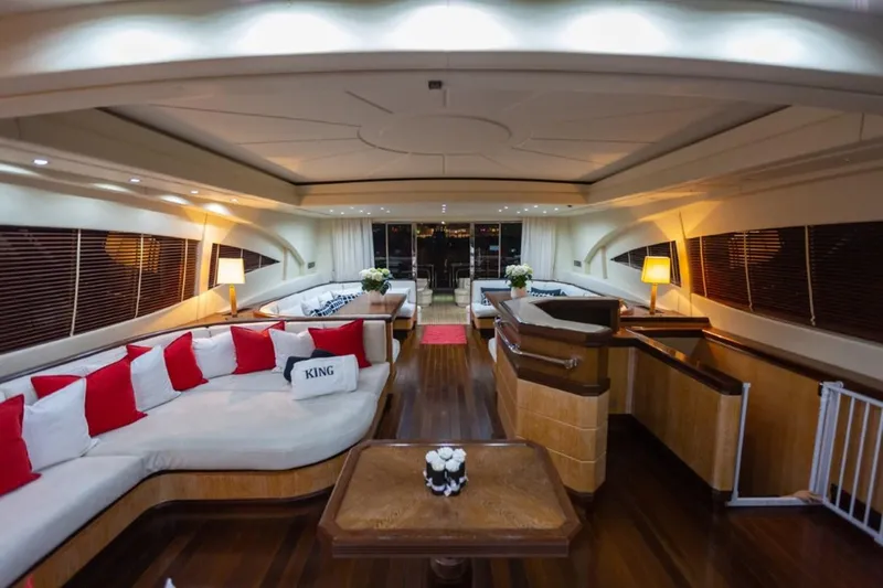  Yacht Photos Pics Luxurious interior of 2004 Mangusta 108 yacht with elegant seating and ambient lighting.