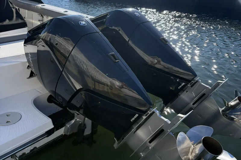  Yacht Photos Pics Twin engines of 2024 Boston Whaler 330R on water.