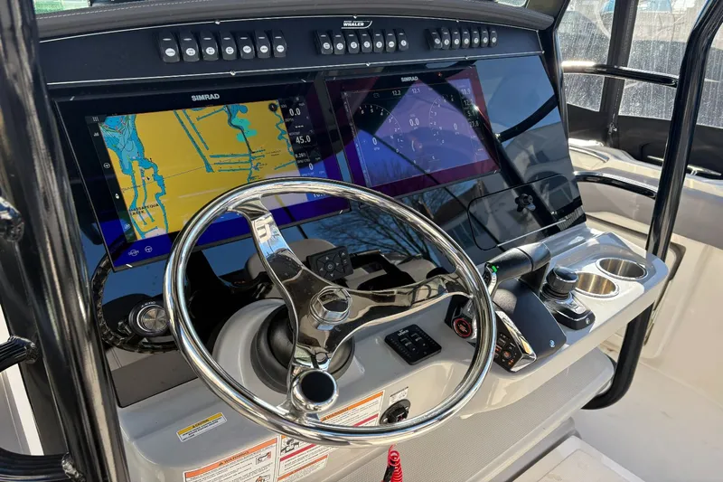  Yacht Photos Pics Boston Whaler 330R 2024 helm with advanced navigation systems.