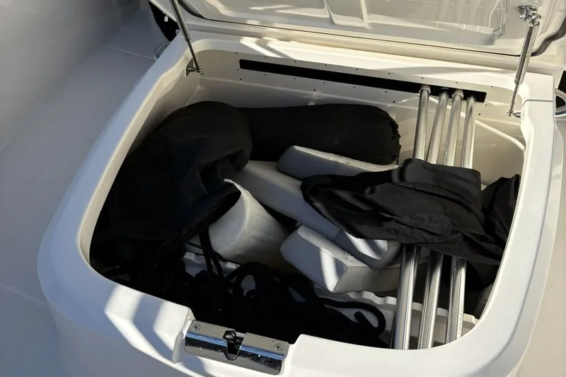  Yacht Photos Pics Storage compartment in Boston Whaler 330R boat, 2024 model.