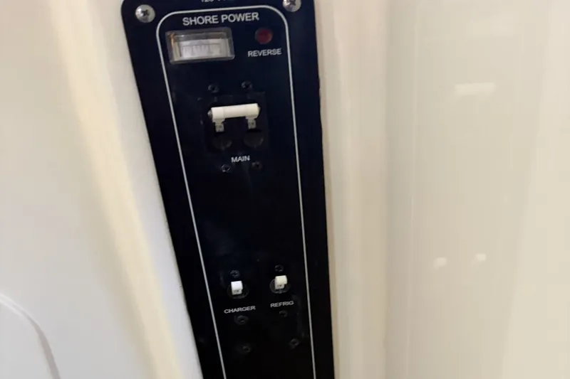  Yacht Photos Pics Boston Whaler 330R 2024 control panel with shore power connection.