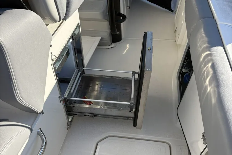  Yacht Photos Pics Boston Whaler 330R 2024, open storage compartment in interior.
