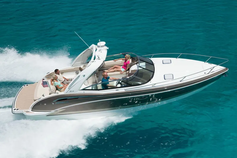  Yacht Photos Pics Manufacturer Provided Image: 2017 Formula 310 Sun Sport boat cruising on clear blue water.