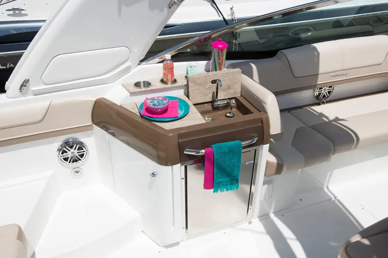  Yacht Photos Pics Manufacturer Provided Image: 2017 Formula 310 Sun Sport boat interior with kitchenette and seating area.