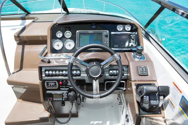  Yacht Photos Pics Manufacturer Provided Image: 2017 Formula 310 Sun Sport boat dashboard with steering wheel and navigation controls.