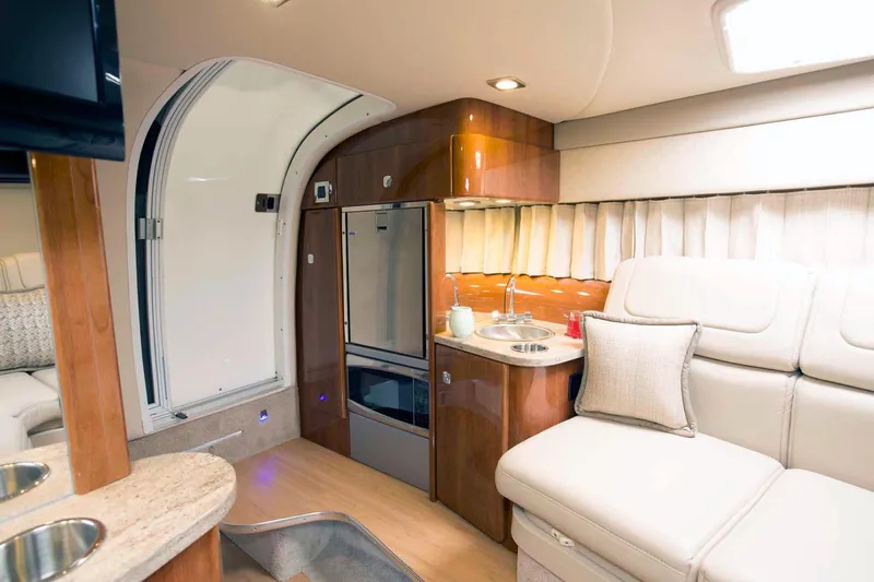  Yacht Photos Pics Manufacturer Provided Image: Interior of 2017 Formula 310 Sun Sport boat with kitchenette and seating area.