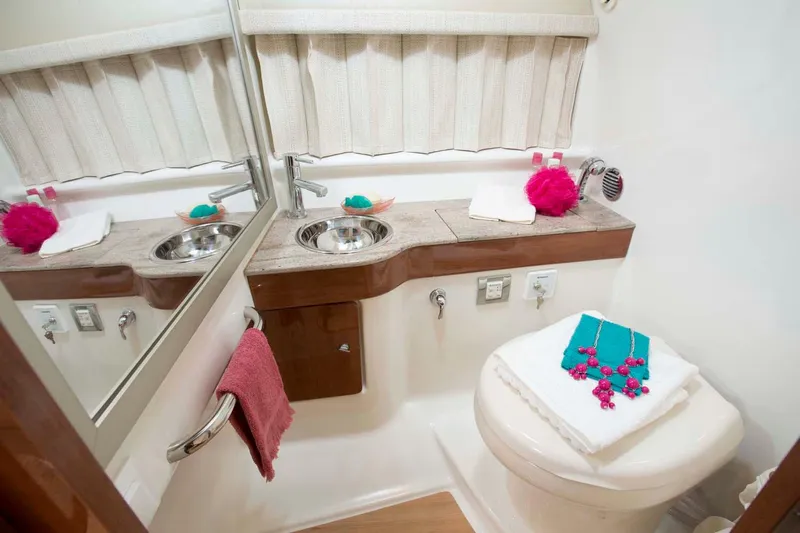  Yacht Photos Pics Manufacturer Provided Image: 2017 Formula 310 Sun Sport bathroom with sink, toilet, and mirror.