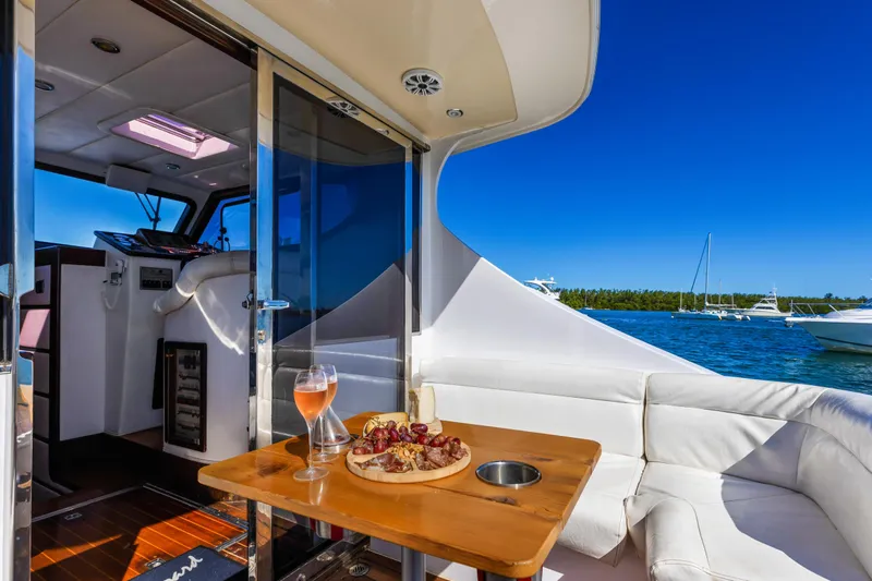 Miss Cathy Yacht Photos Pics Luxurious yacht interior with wine and charcuterie, NNS Sea Scout 41, 2007 model, ocean view.