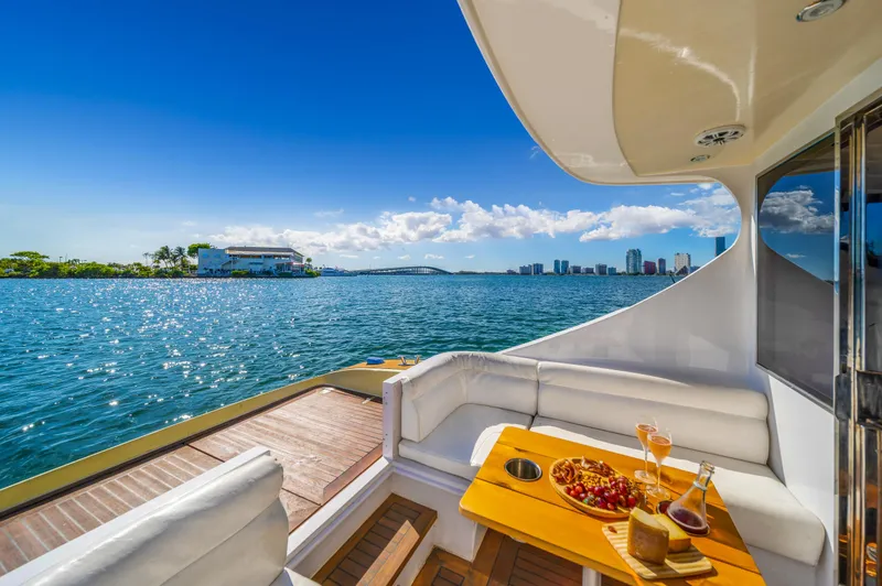 Miss Cathy Yacht Photos Pics Luxurious 2007 NNS Sea Scout 41 yacht with scenic ocean view and elegant dining setup.