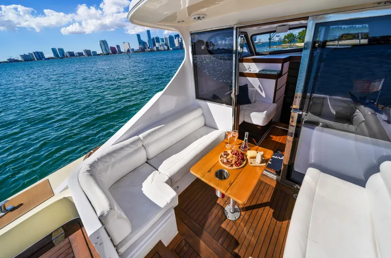 Miss Cathy Yacht Photos Pics Luxurious 2007 Custom NNS Sea Scout 41 yacht with elegant deck seating and ocean view.