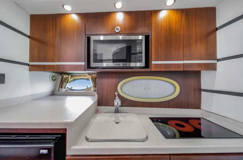 Miss Cathy Yacht Photos Pics Modern kitchen in 2007 Custom NNS Sea Scout 41 yacht with microwave and stovetop.