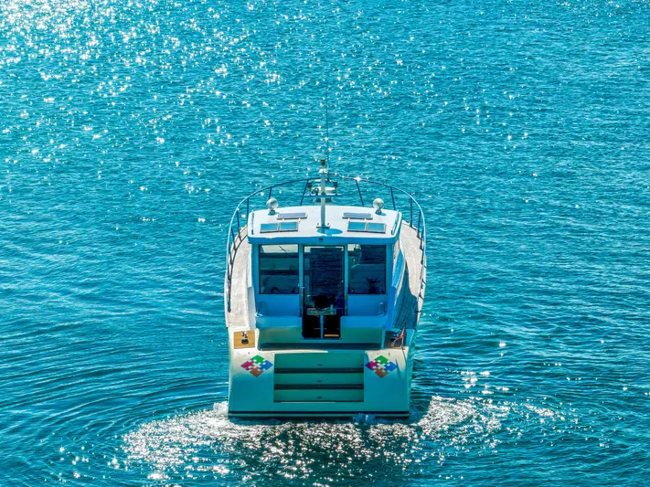Miss Cathy Yacht Photos Pics Custom NNS Sea Scout 41 boat cruising on sparkling blue water, 2007 model.