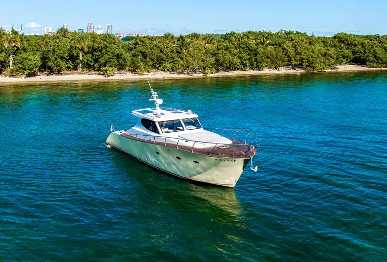 Miss Cathy Yacht Photos Pics Custom NNS Sea Scout 41 yacht cruising near lush shoreline, 2007 model.