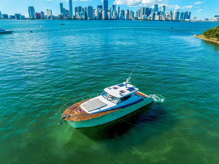 Miss Cathy Yacht Photos Pics Custom NNS Sea Scout 41 boat on clear water with city skyline, 2007 model.