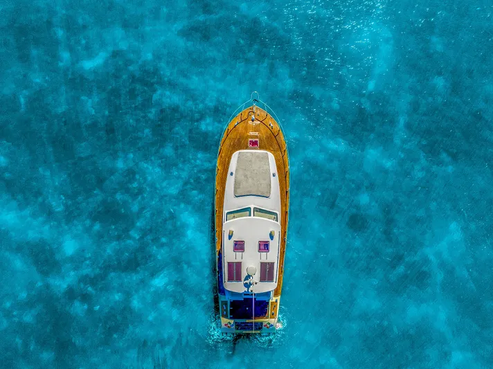 Miss Cathy Yacht Photos Pics Aerial view of 2007 Custom NNS Sea Scout 41 on clear blue water.