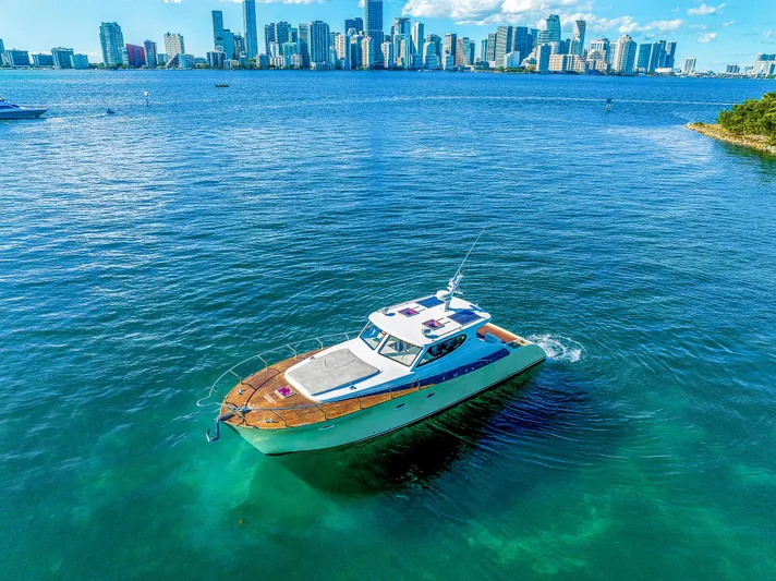 Miss Cathy Yacht Photos Pics Custom NNS Sea Scout 41 boat cruising near city skyline, 2007 model.