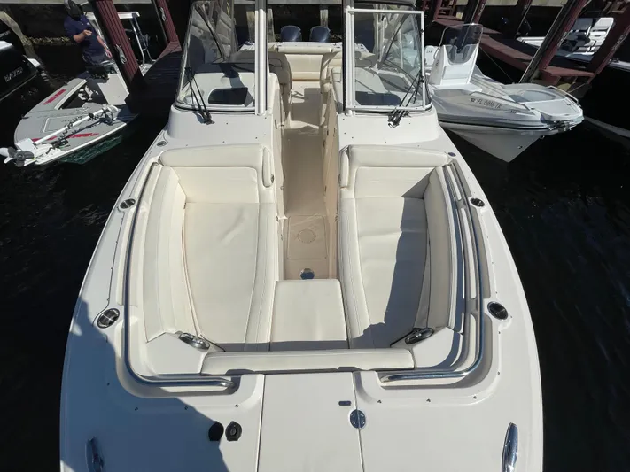  Yacht Photos Pics 2019 Grady-White Freedom 325 boat with spacious seating, docked at marina.