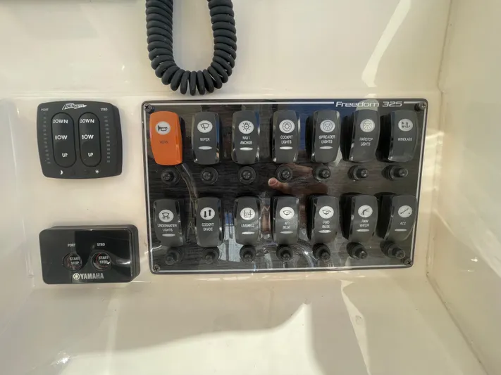  Yacht Photos Pics Control panel of 2019 Grady-White Freedom 325 boat with various switches and Yamaha controls.