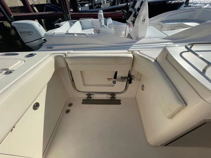  Yacht Photos Pics 2019 Grady-White Freedom 325 boat interior with seating and storage compartments.