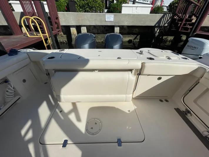  Yacht Photos Pics 2019 Grady-White Freedom 325 boat interior with dual engines and seating area.