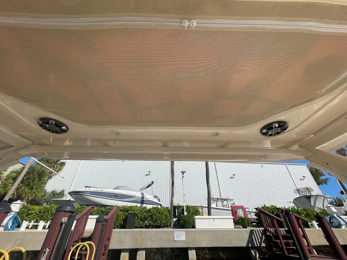  Yacht Photos Pics 2019 Grady-White Freedom 325 boat interior with speakers, docked near a marina.