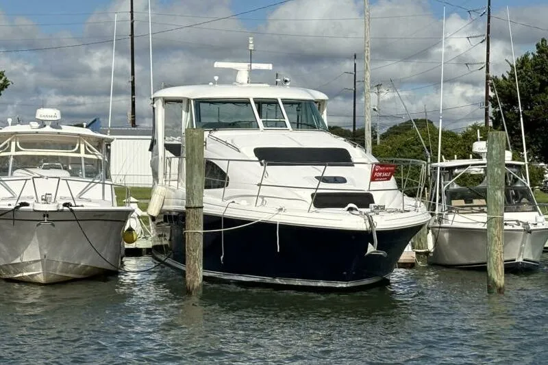 Inconspicuous Yacht Photos Pics 2006 Sea Ray 40 Motor Yacht docked, for sale sign visible.