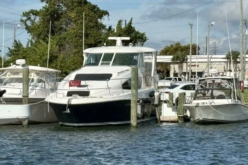 Inconspicuous Yacht Photos Pics 2006 Sea Ray 40 Motor Yacht docked, for sale sign visible.