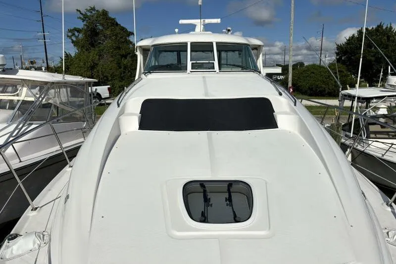 Inconspicuous Yacht Photos Pics 2006 Sea Ray 40 Motor Yacht, white exterior, docked with clear sky background.