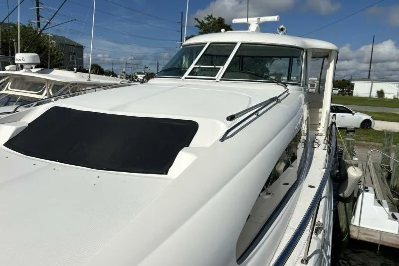 Inconspicuous Yacht Photos Pics 2006 Sea Ray 40 Motor Yacht docked, showcasing sleek design and spacious deck.