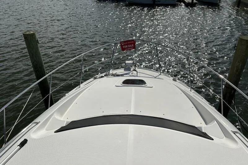 Inconspicuous Yacht Photos Pics 2006 Sea Ray 40 Motor Yacht for sale, docked on sparkling water.