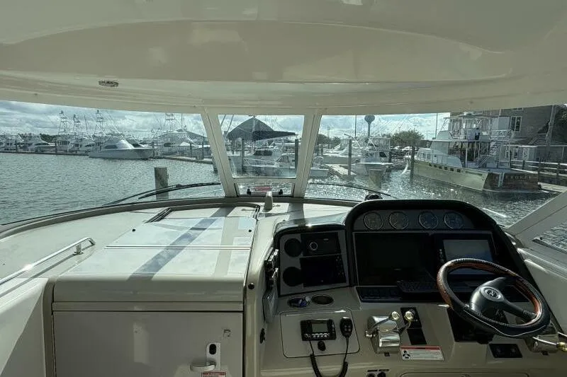 Inconspicuous Yacht Photos Pics 2006 Sea Ray 40 Motor Yacht helm view, marina background, sunny day.