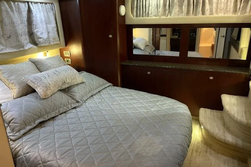 Inconspicuous Yacht Photos Pics Luxurious bedroom interior of 2006 Sea Ray 40 Motor Yacht with cozy bedding and elegant decor.