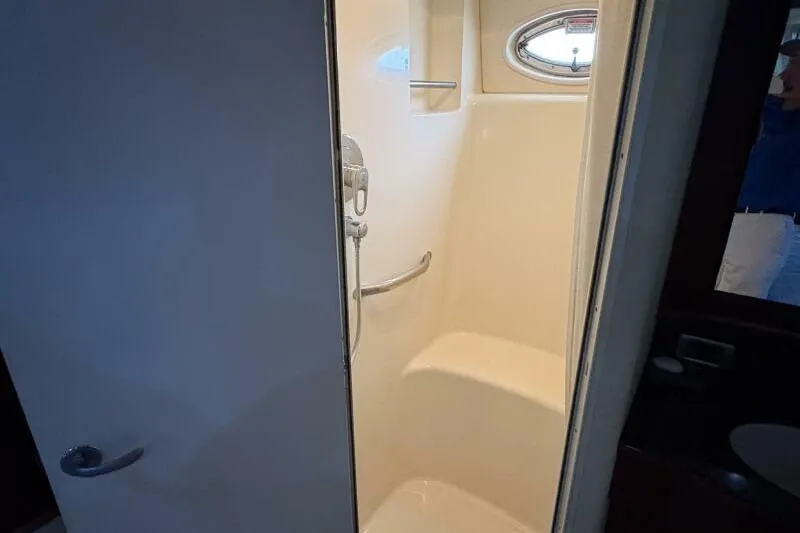 Inconspicuous Yacht Photos Pics Shower area in 2006 Sea Ray 40 Motor Yacht with porthole window.