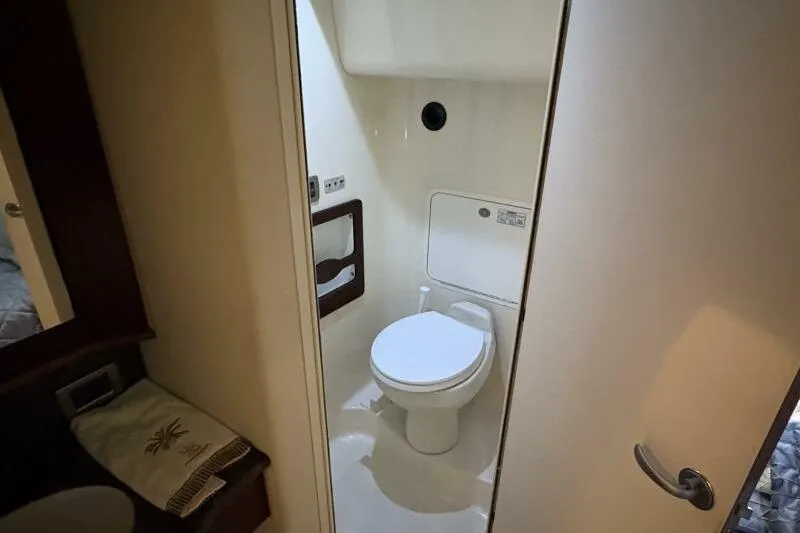 Inconspicuous Yacht Photos Pics Bathroom interior of 2006 Sea Ray 40 Motor Yacht, featuring a compact toilet setup.